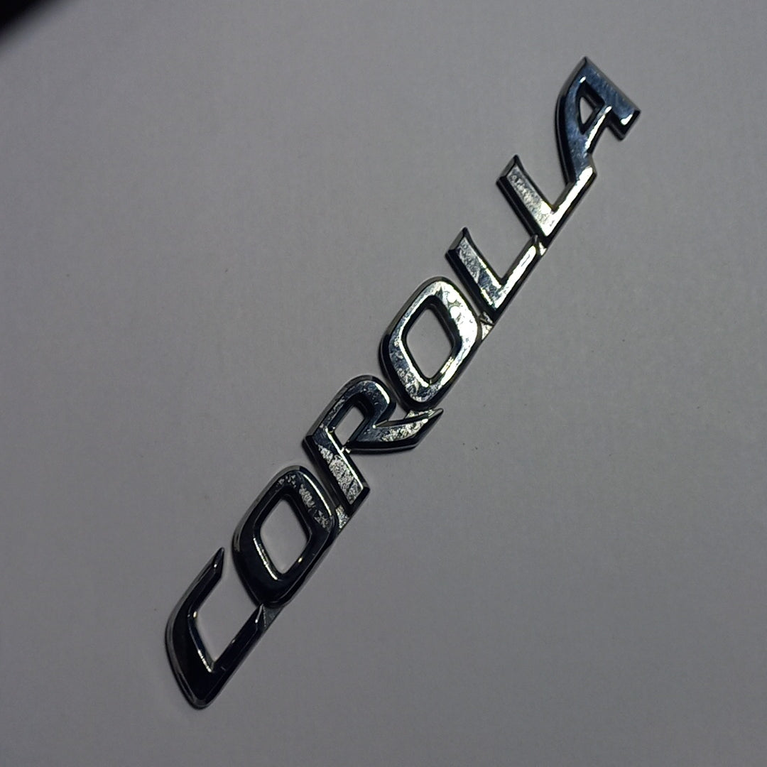 Emblema Letra Corolla