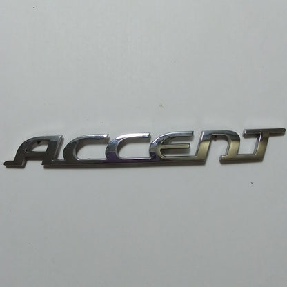 Emblema Letra Accent