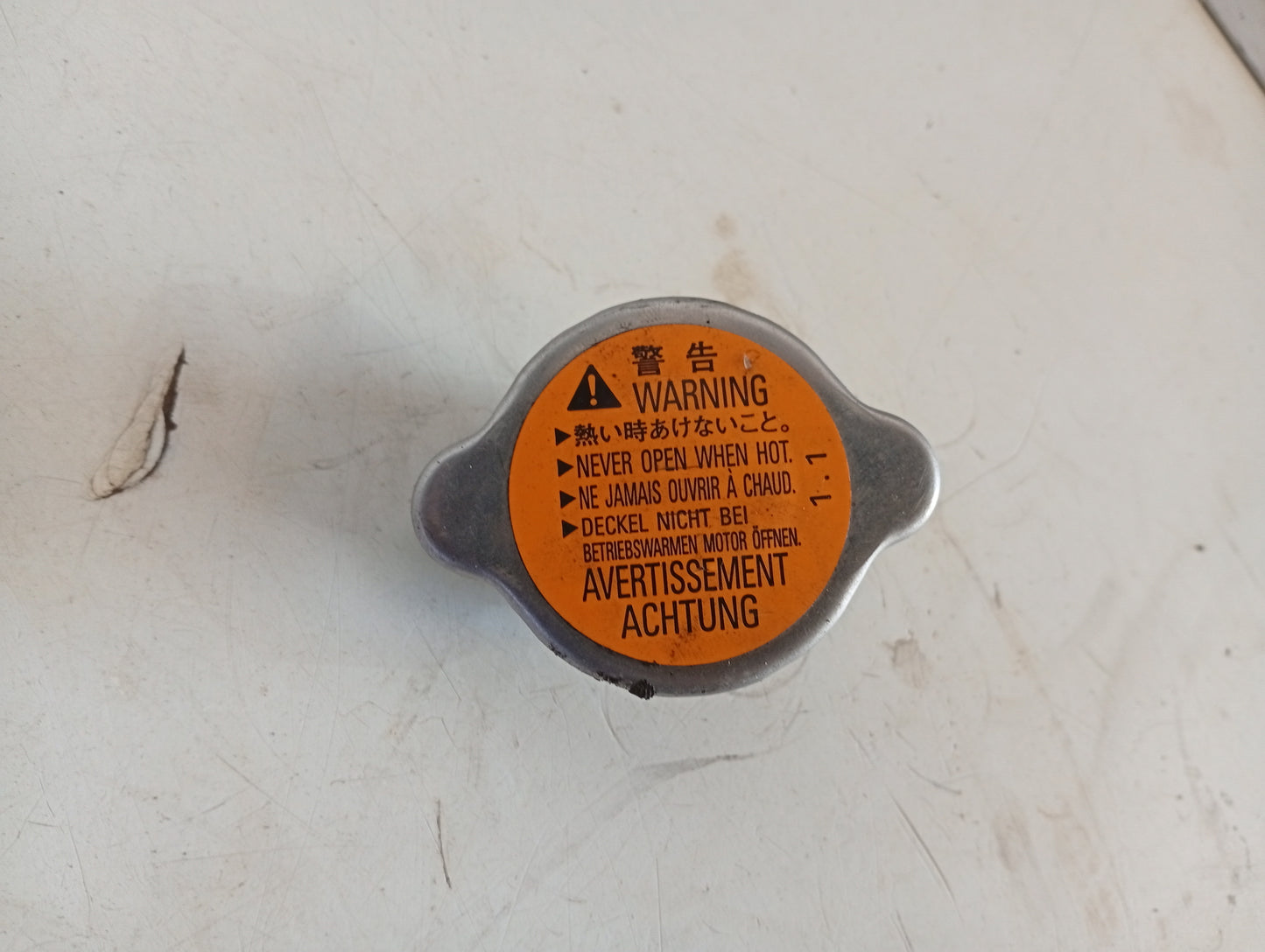 Tapa Radiador Mitsubishi Outlander